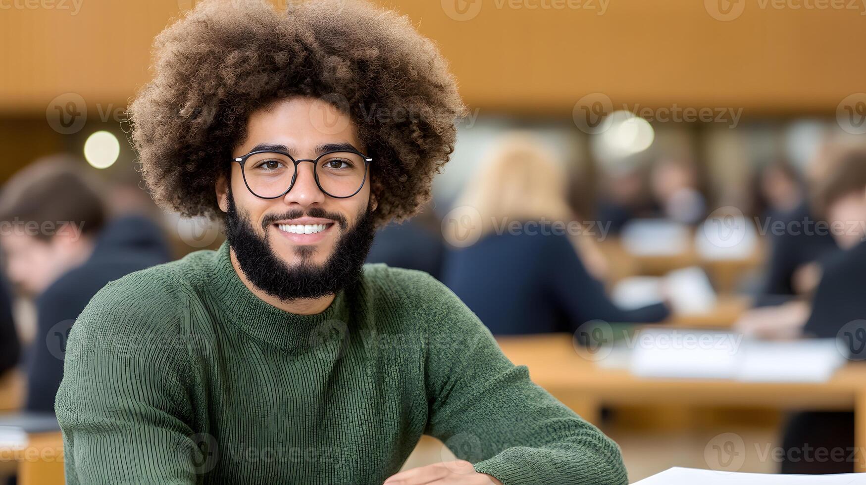 A student writing in a notebook focused on their studies in a classroom photo