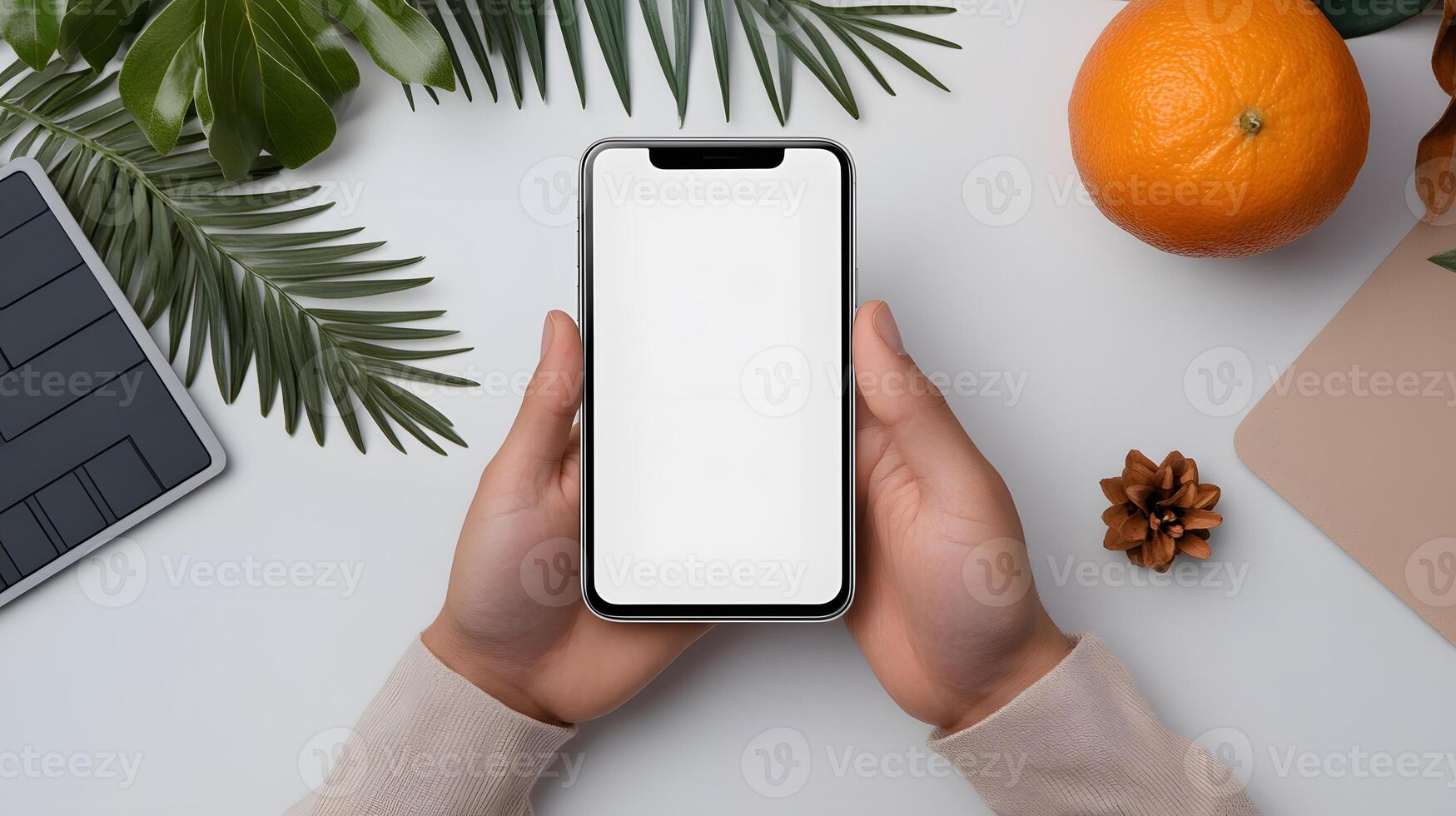 Hand holding smartphone mockup with blank white screen, modern workspace background photo