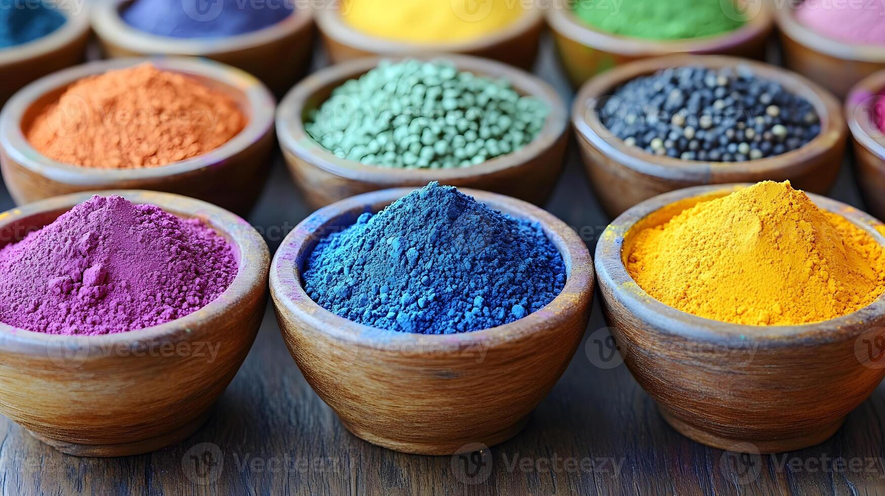 A serene shot of vibrant colored powders arranged in bowls before the start of a Holi festival photo