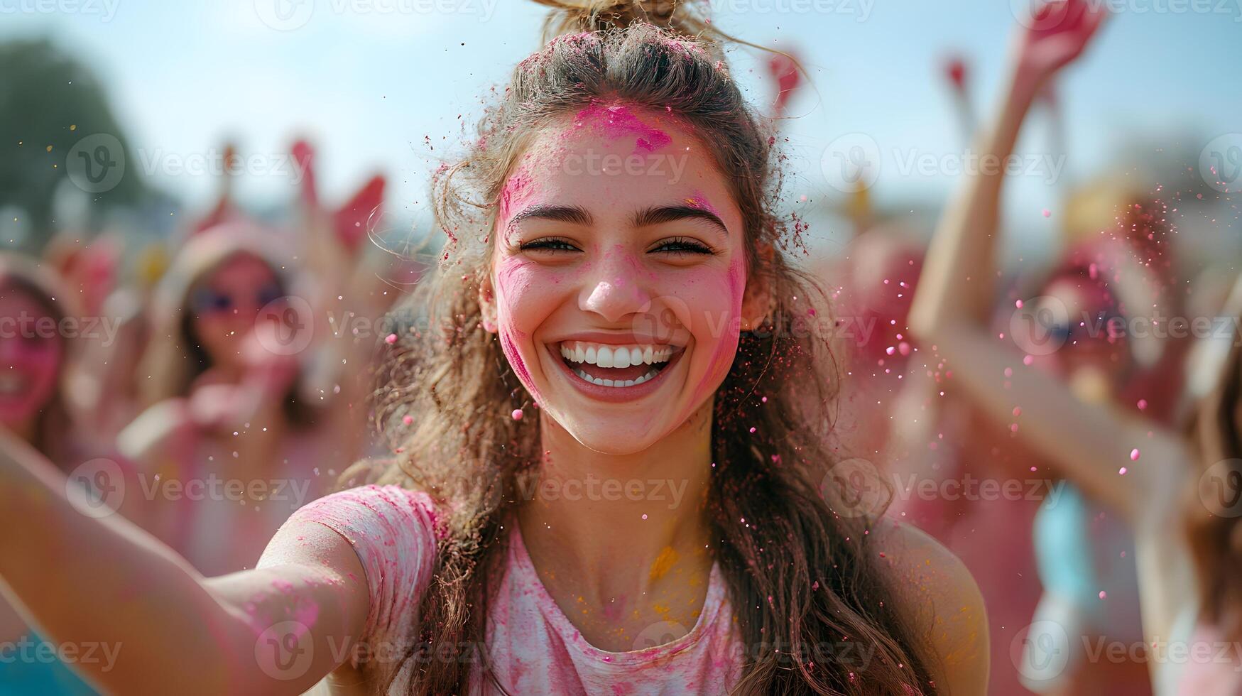 A group of friends throwing vibrant colors during Holi festivities with bright smiles and traditional Indian attire photo