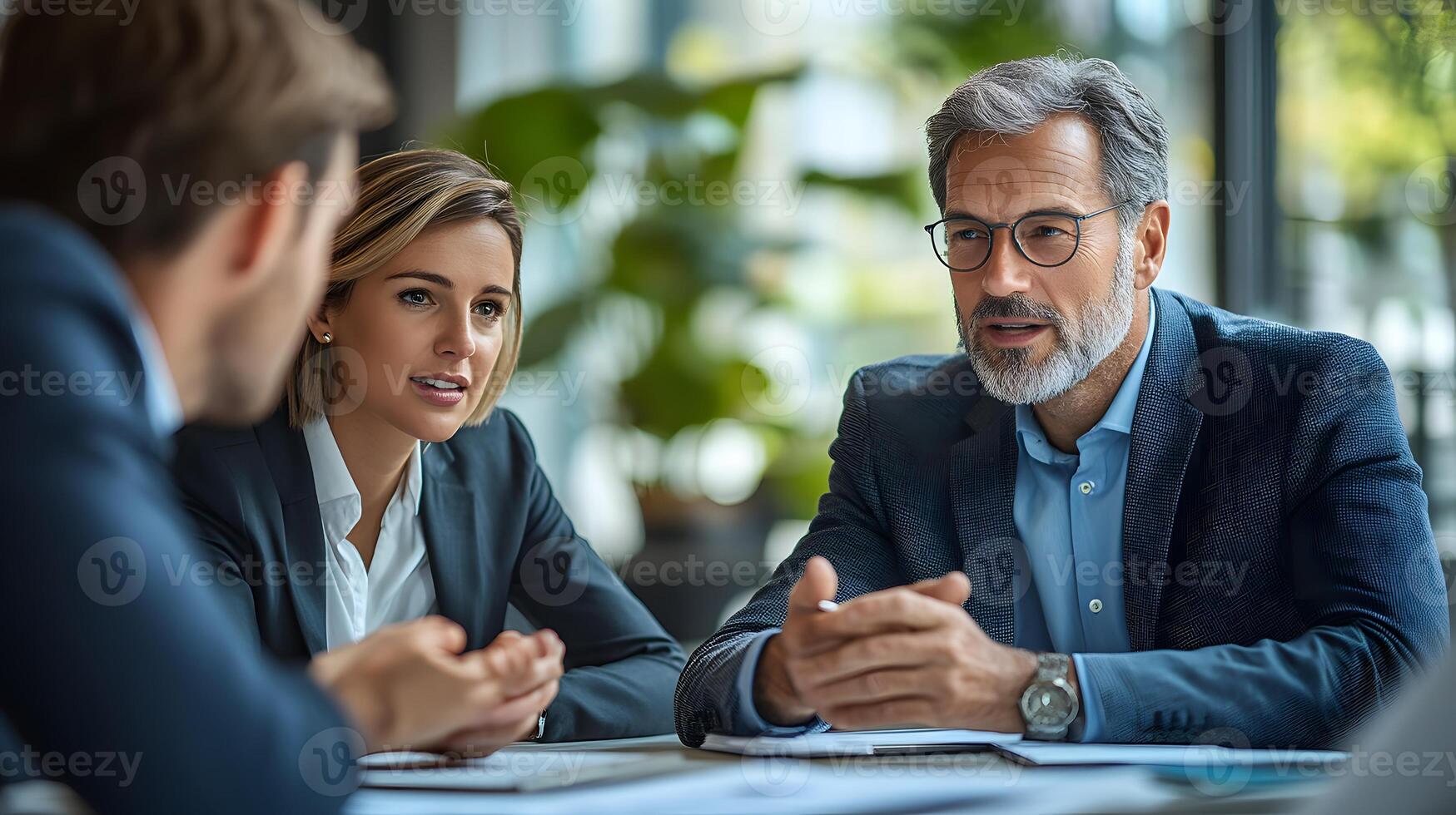 Professional business team discussing technology solutions in a modern office photo