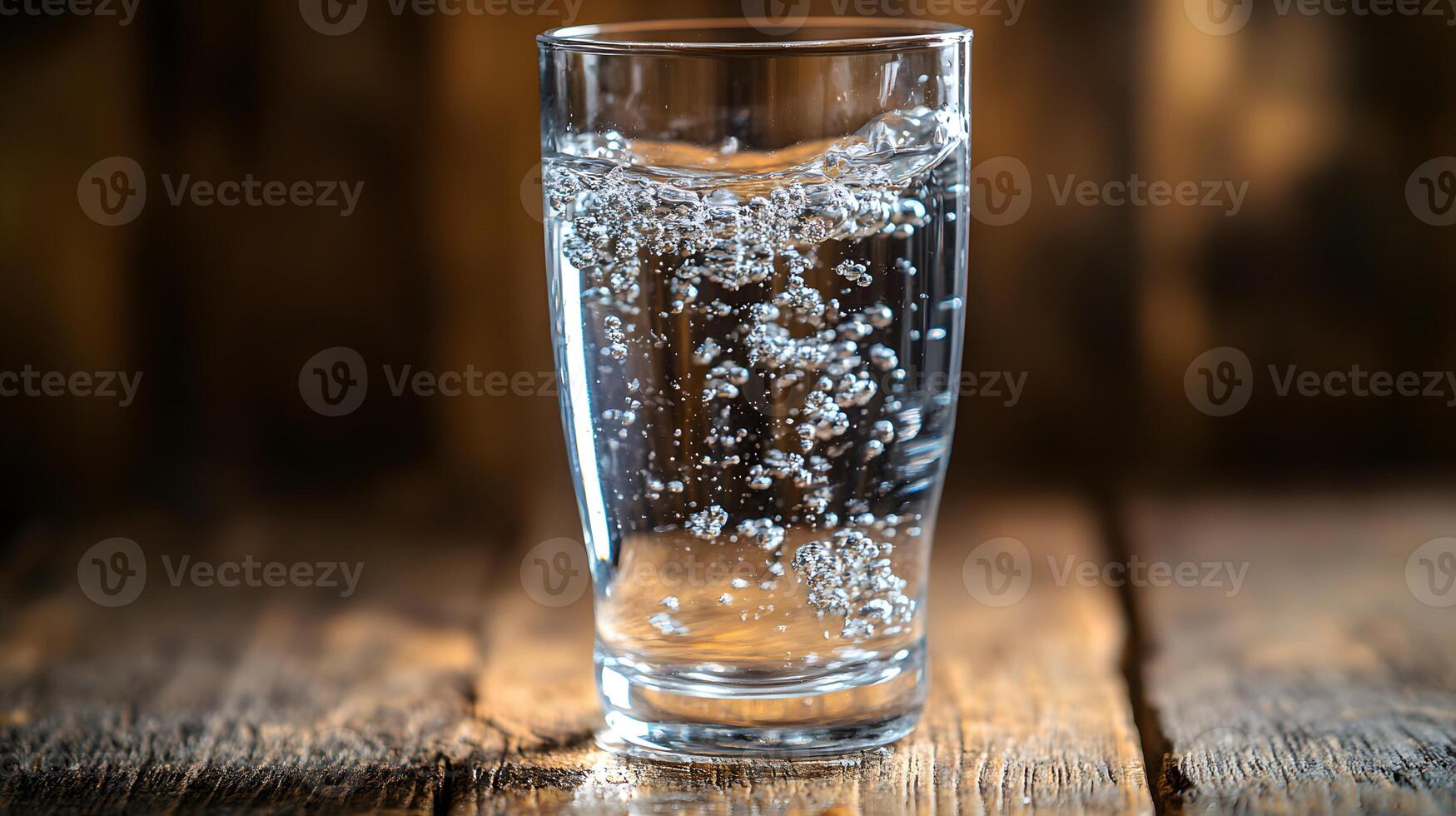 Close-up of a transparent glass of water on a wooden table, minimalist and pure composition, symbol of hydration and health, 8K high resolution with copy space photo