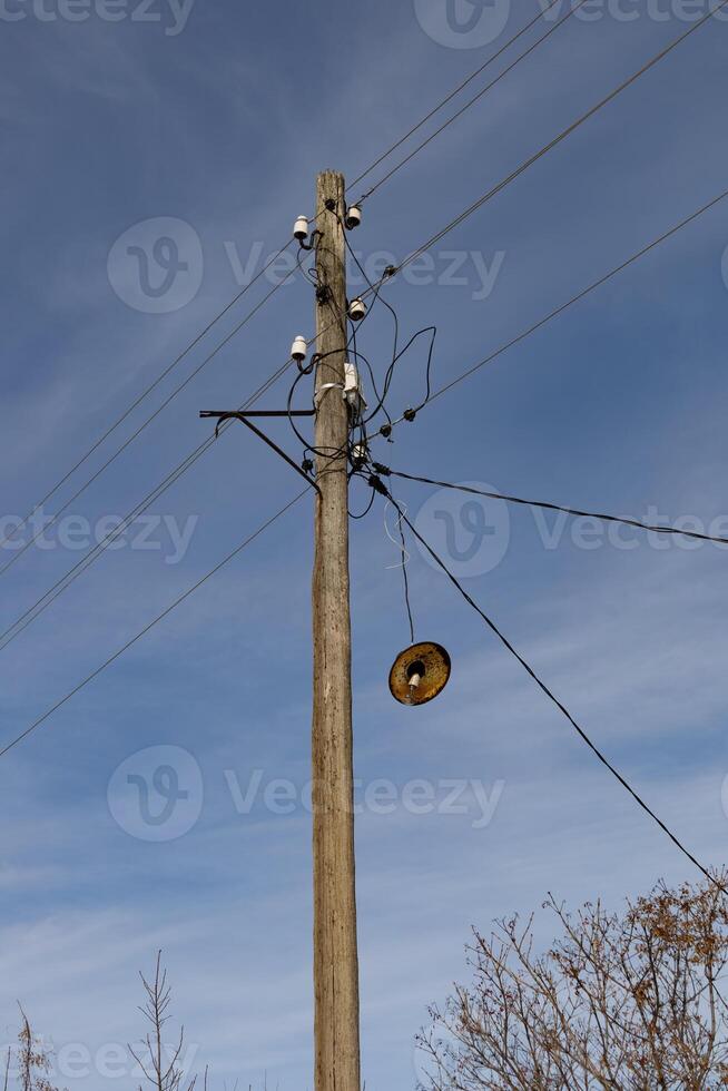 electricity post with blue sky background, close-up of photo