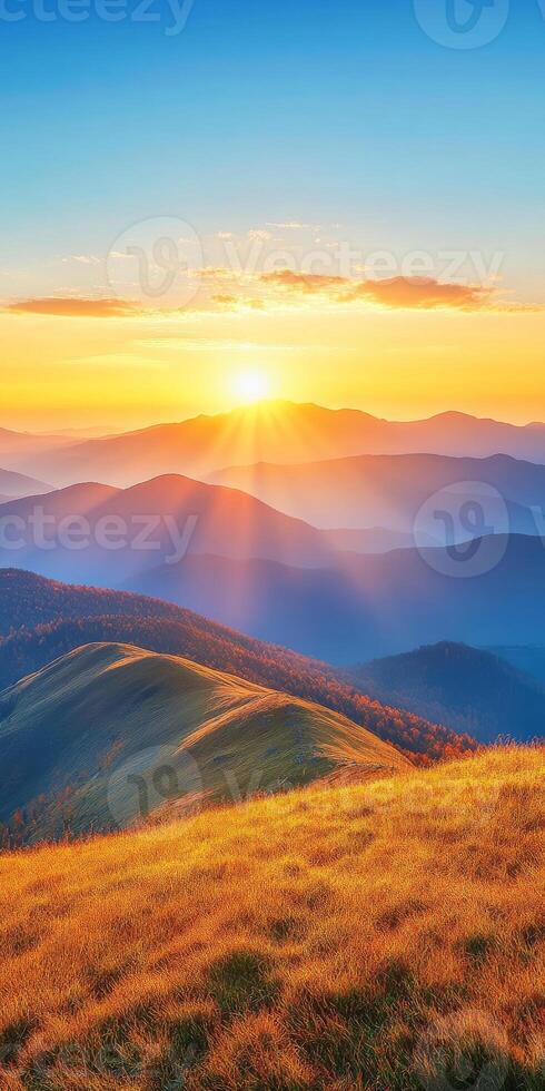 breathtaking landscape showcasing rolling hills and mountains at sunset, with vibrant colors illuminating sky and creating serene atmosphere photo
