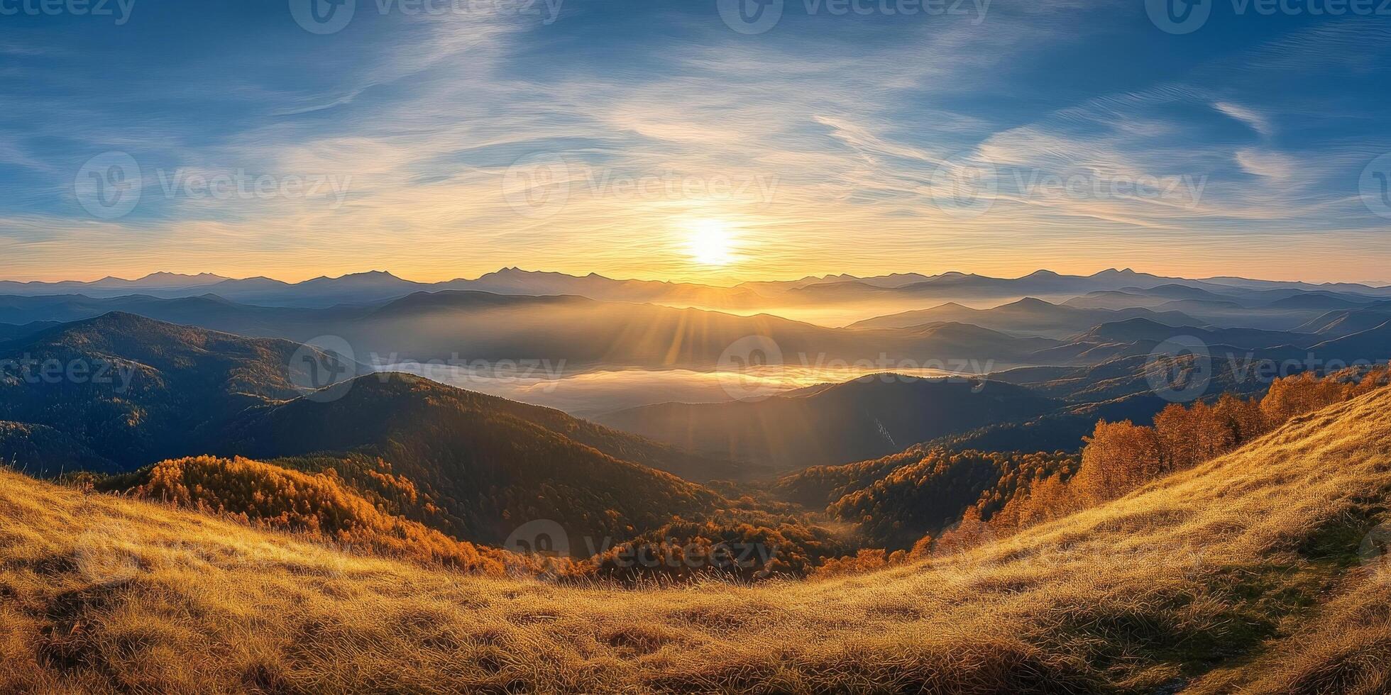 breathtaking sunrise over mountainous landscape, showcasing rolling hills, golden grass, and misty valley below. warm light creates serene and tranquil atmosphere photo
