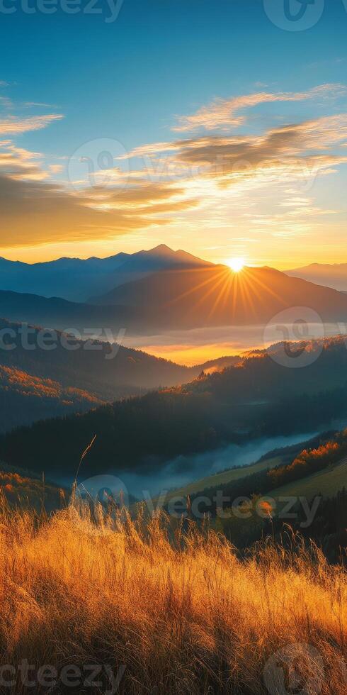 breathtaking sunrise over mountains, casting golden rays on lush valleys and misty landscapes. vibrant colors of nature evoke sense of tranquility and awe photo