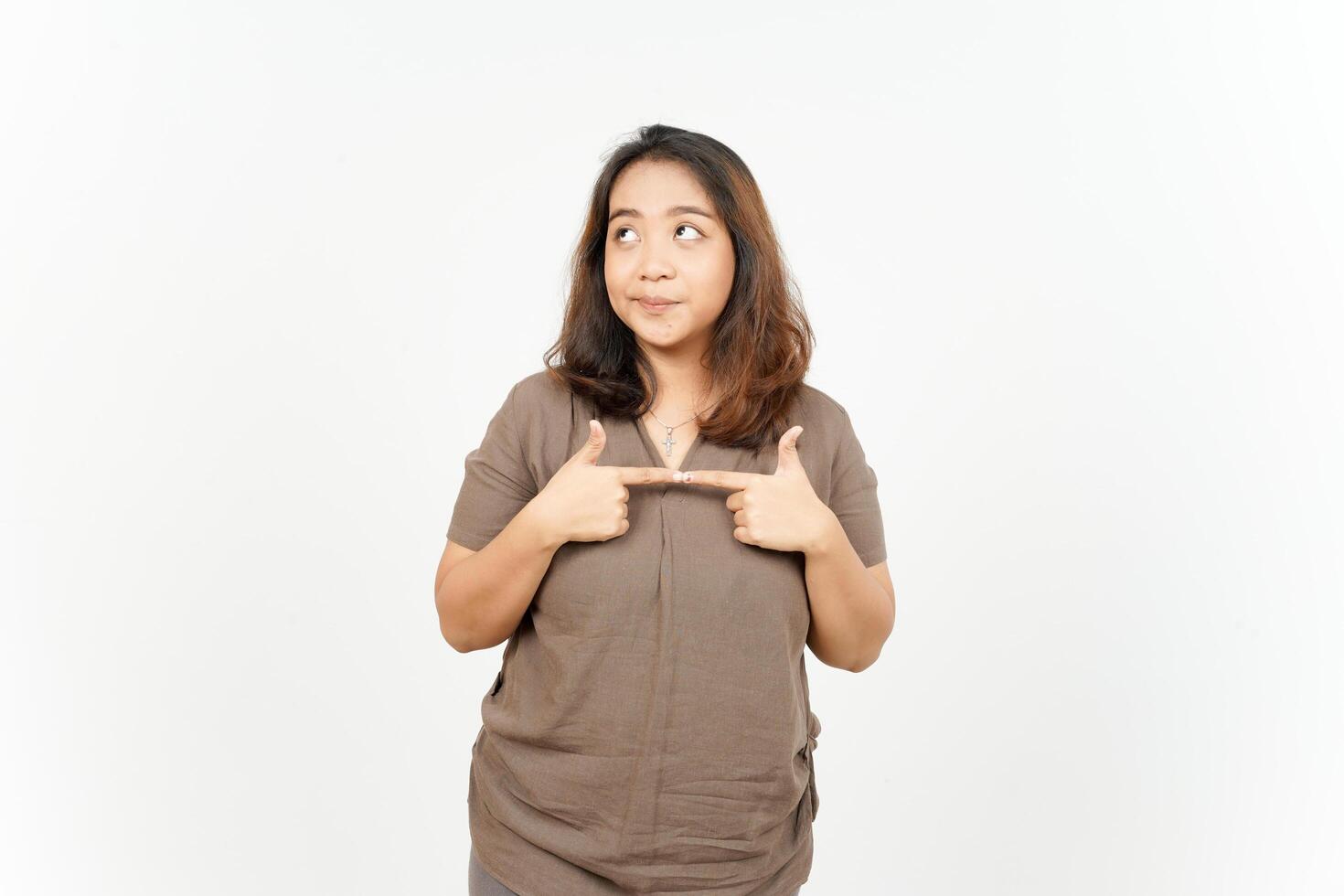 A woman is pointing at something with her hands photo