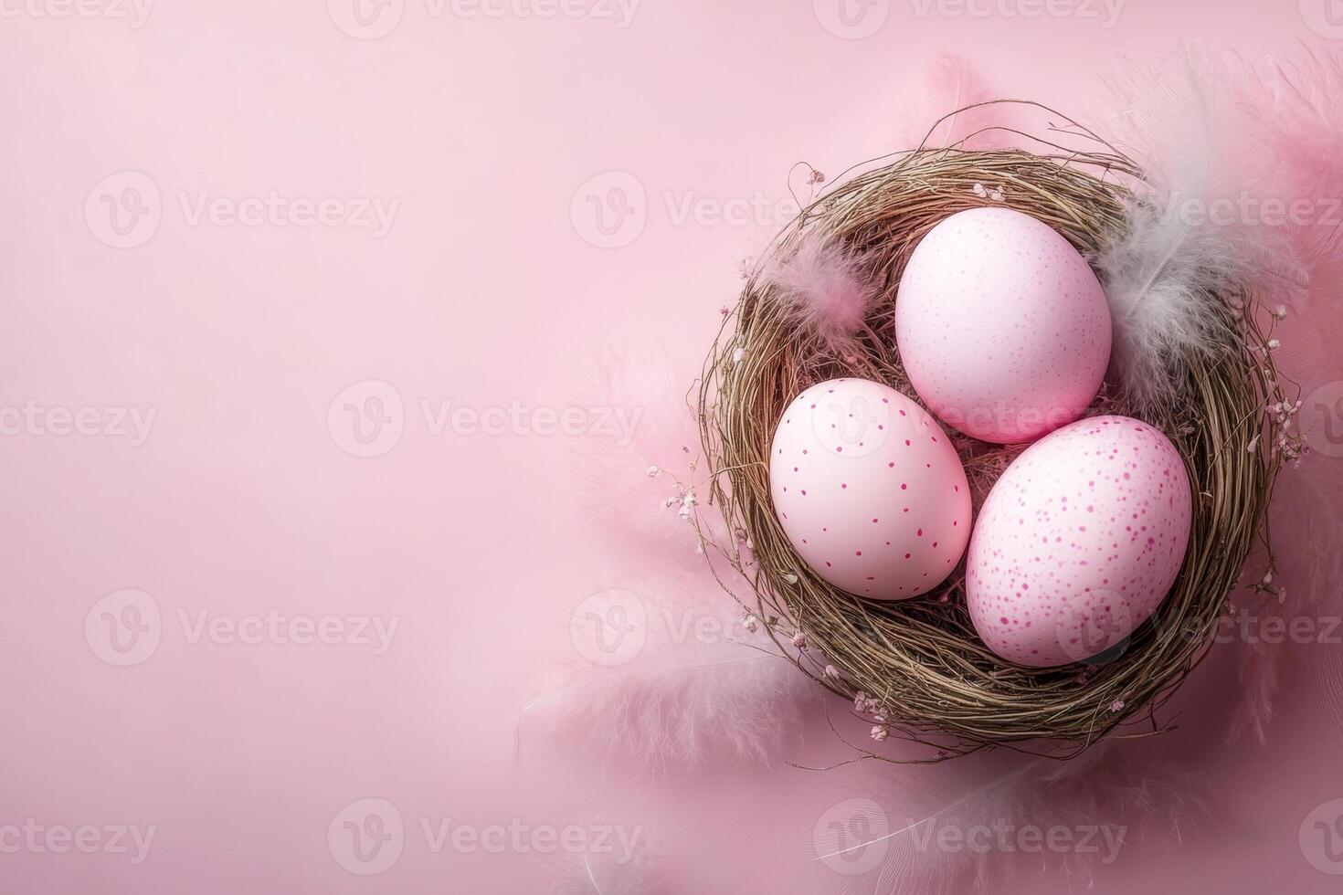 Easter eggs in a nest on a pink background with feathers. photo