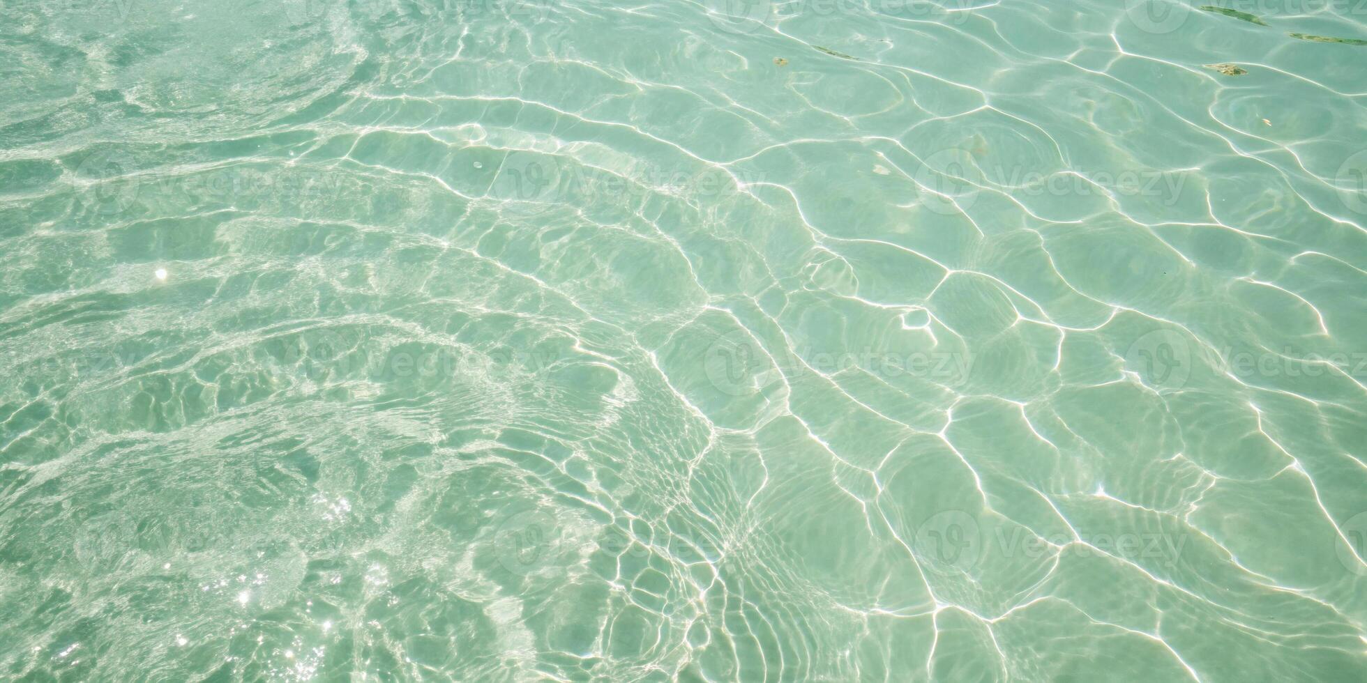 Clear Shallow Water with Gentle Sunlight Ripples photo