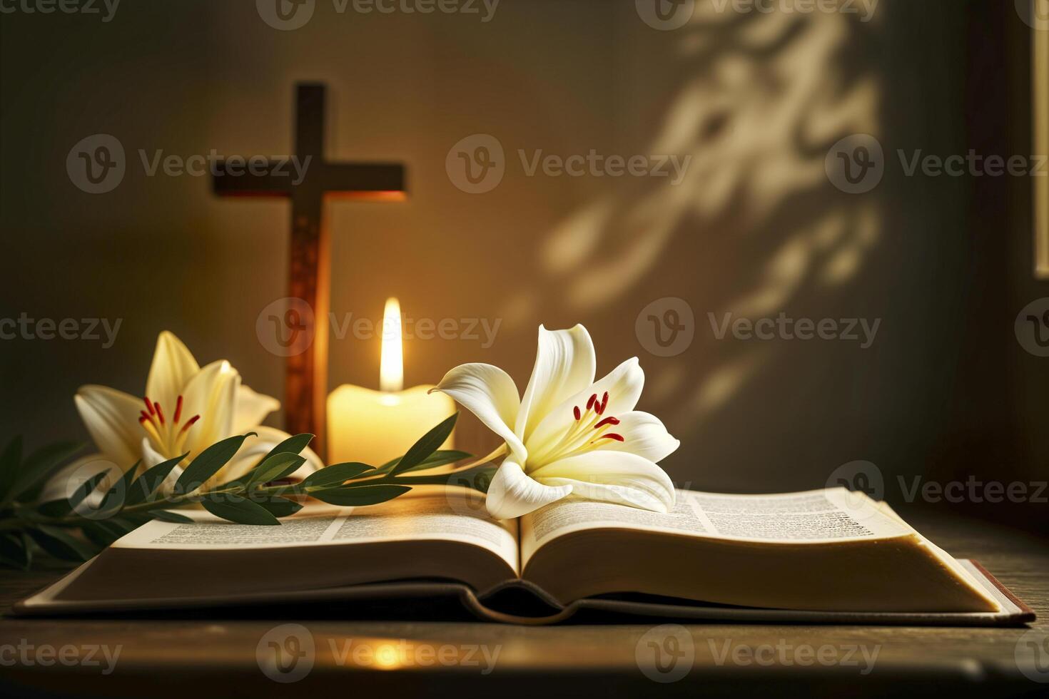 Open Bible with Easter lily, candle, and cross in warm light. photo