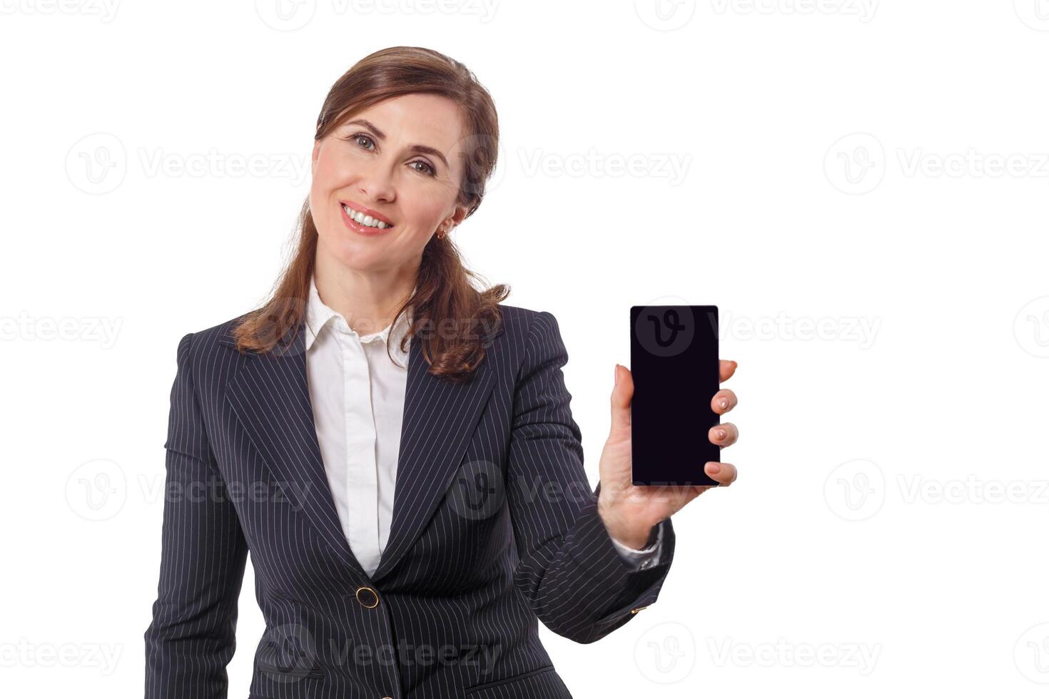 Portrait of a beautiful businesswoman 50 ears old with mobile phone isolated on white. photo