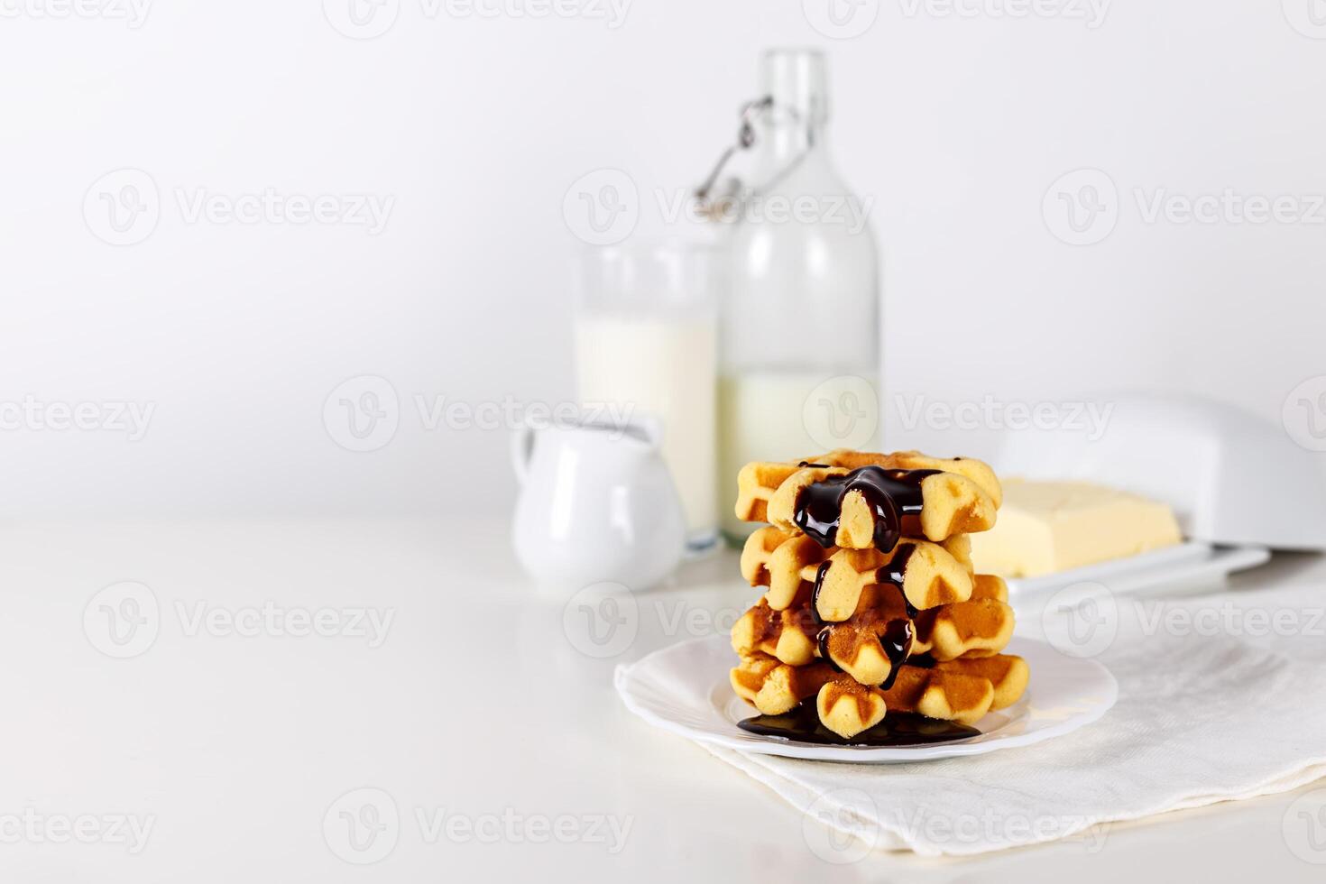 Fresh Belgian waffles with chocolate white wooden background. selective focus. with copy space photo