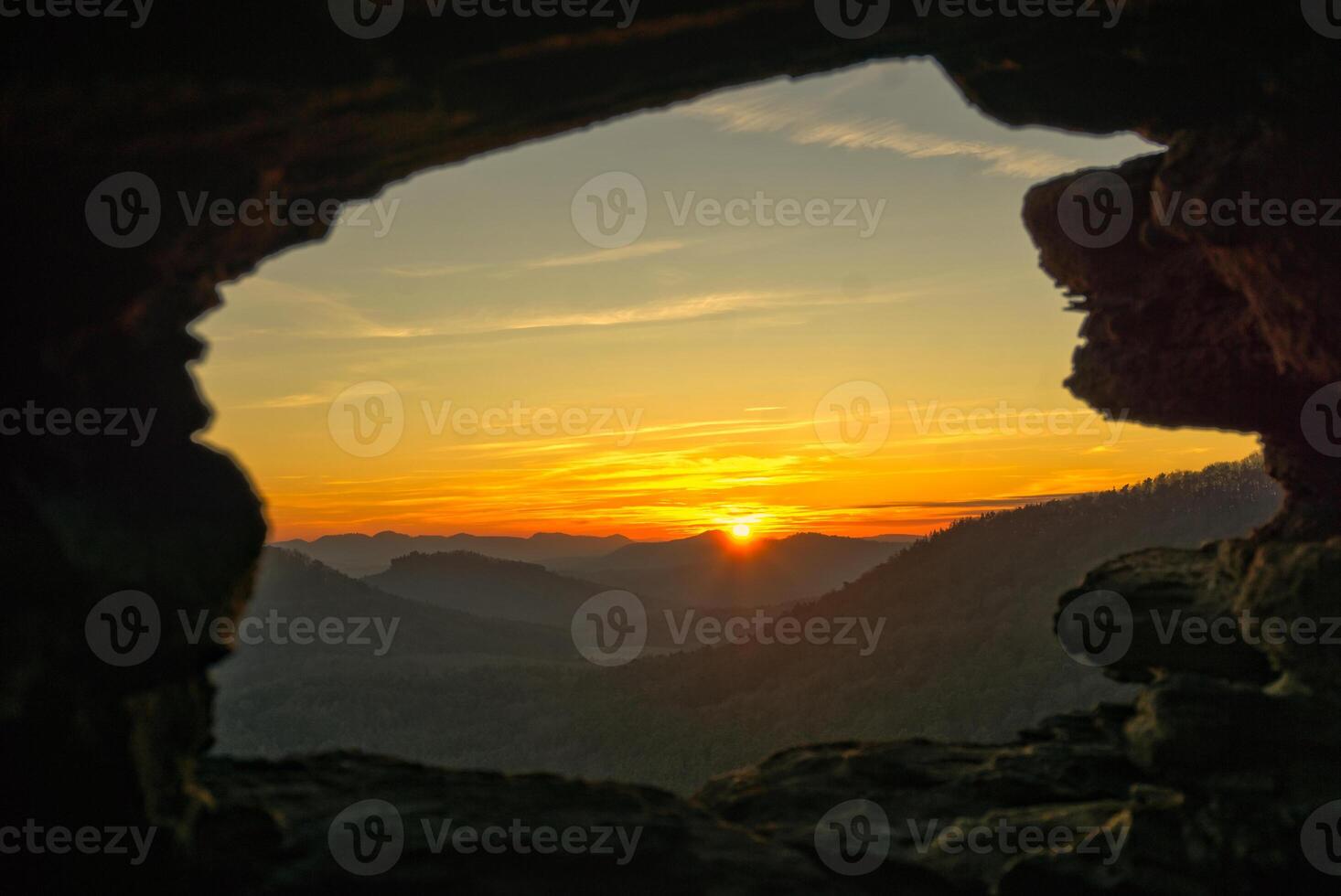 View through a natural rock window in the palatinate forest photo