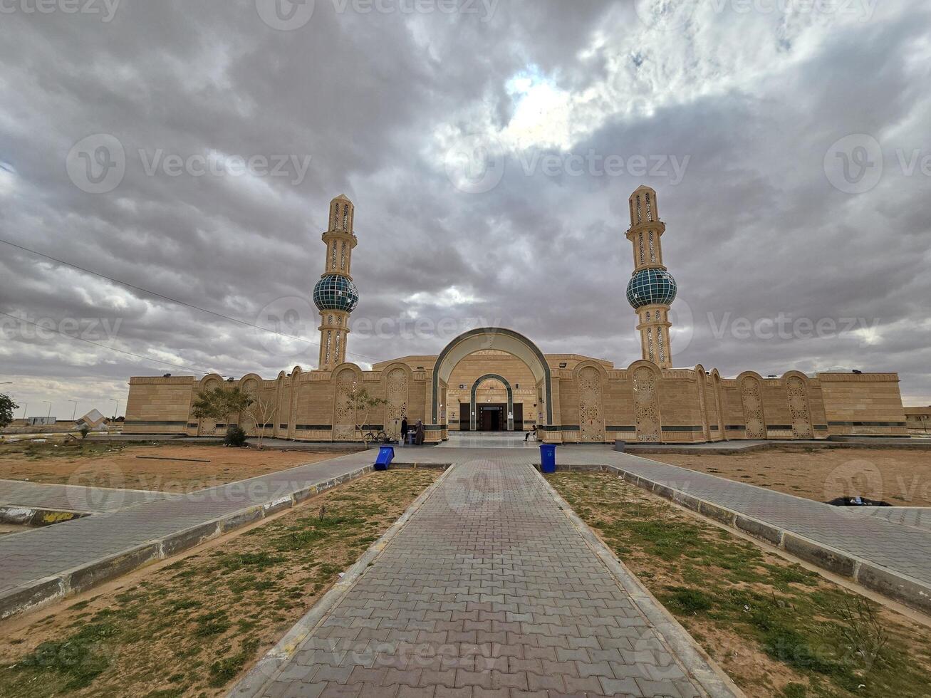 A large mosque with two minarets and a sky background photo