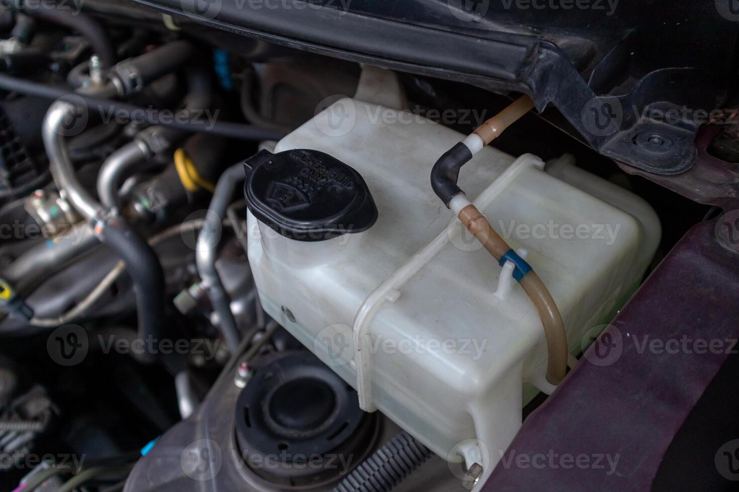 A tube of car window washer fluid. The wiper fluid tube for the windshield. photo