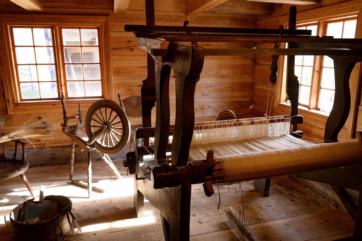 Old spinning wheel loom machine in interior in the Museum Kulturen Lund Sweden. photo