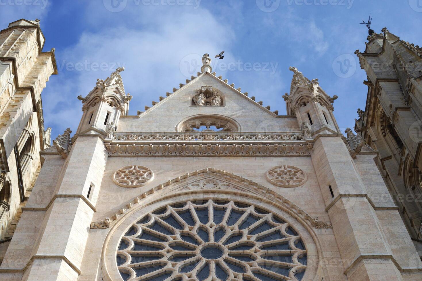 Detailed view of a Gothic cathedrals rose window and historic architecture. Basilica Catedral de Santa Maria de Leon photo