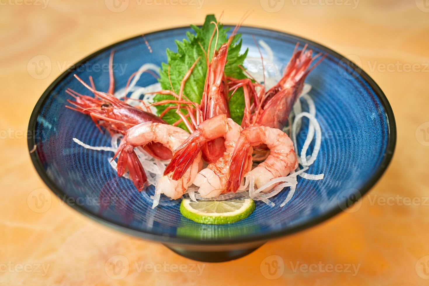 Delectable shrimps served in plate on table photo