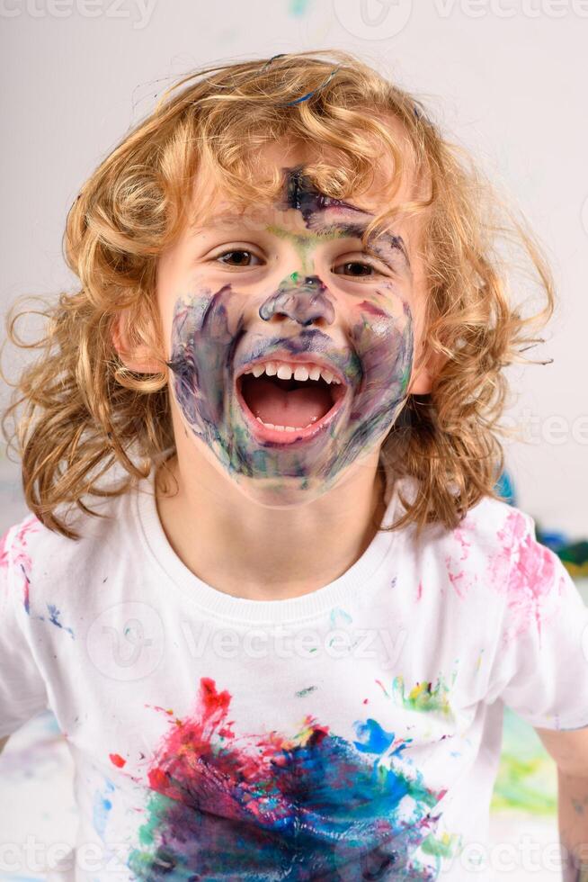 Cheerful boy with painted face photo