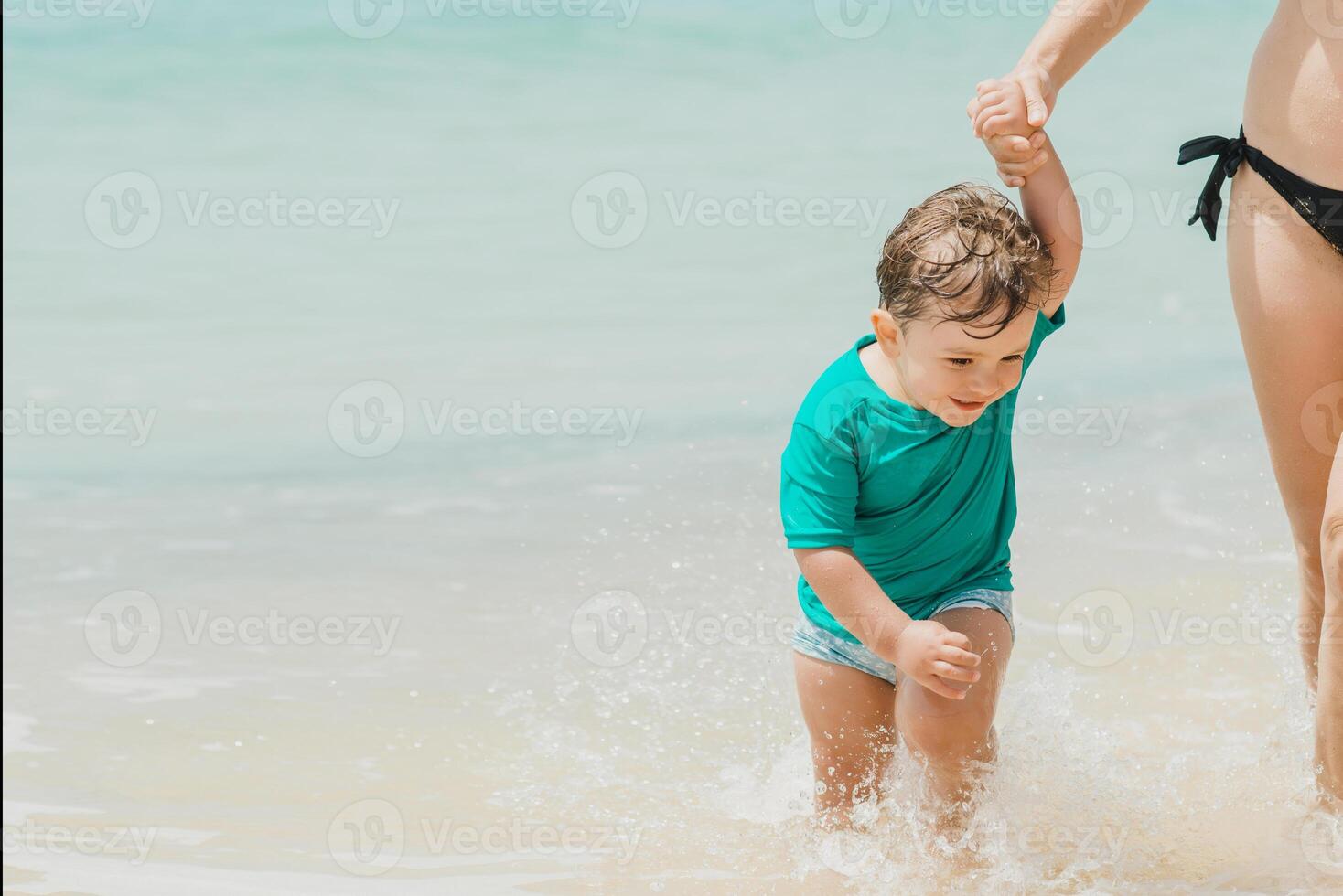 Happy child enjoying summer holidays on beach photo