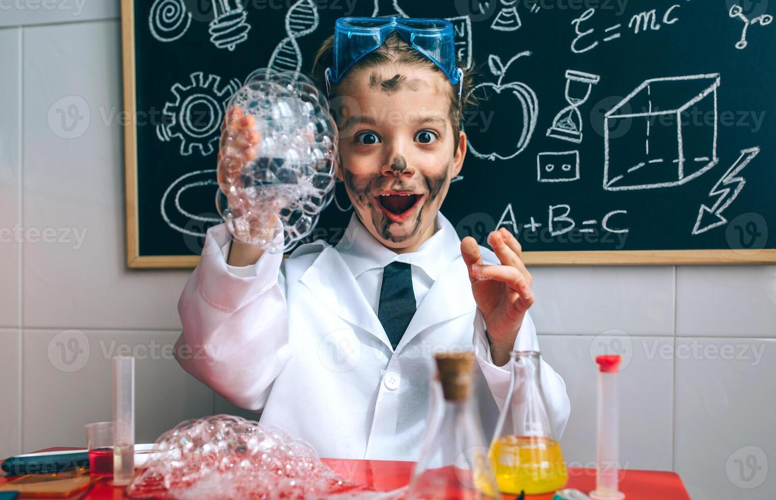 Funny boy chemist with dirty face photo
