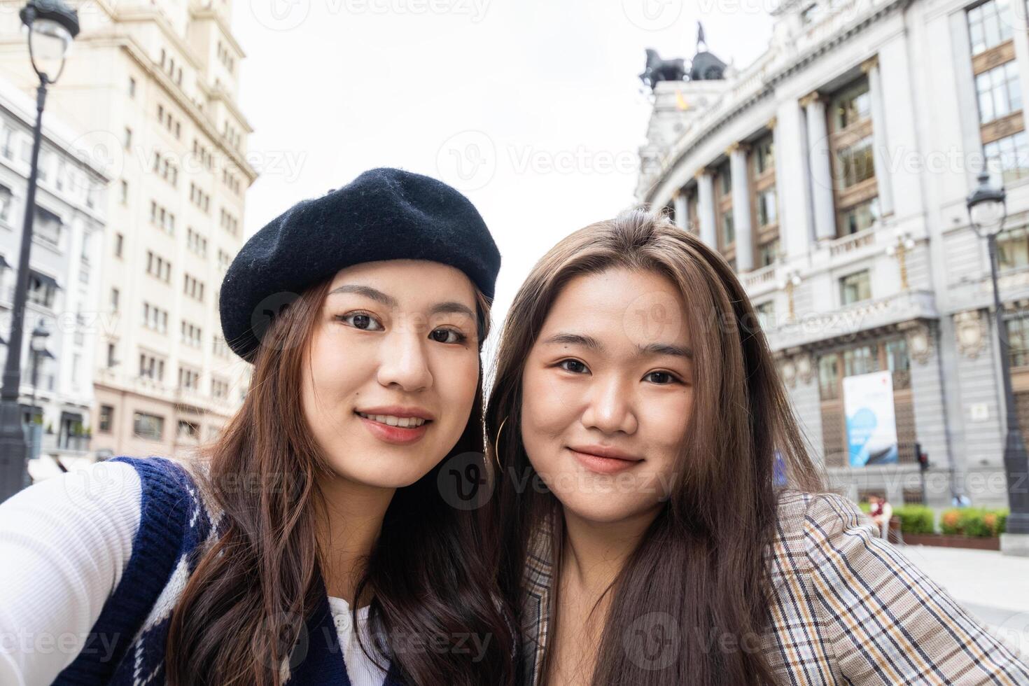 Selfie of asian female friends in the city photo