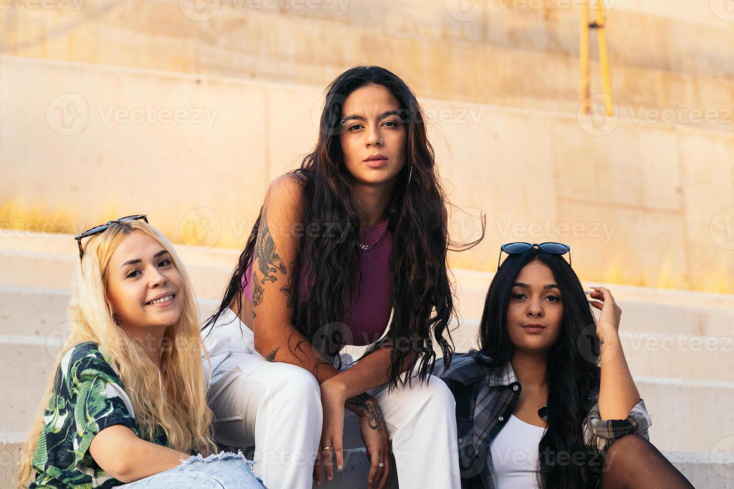 Stylish young women outdoors in the city photo