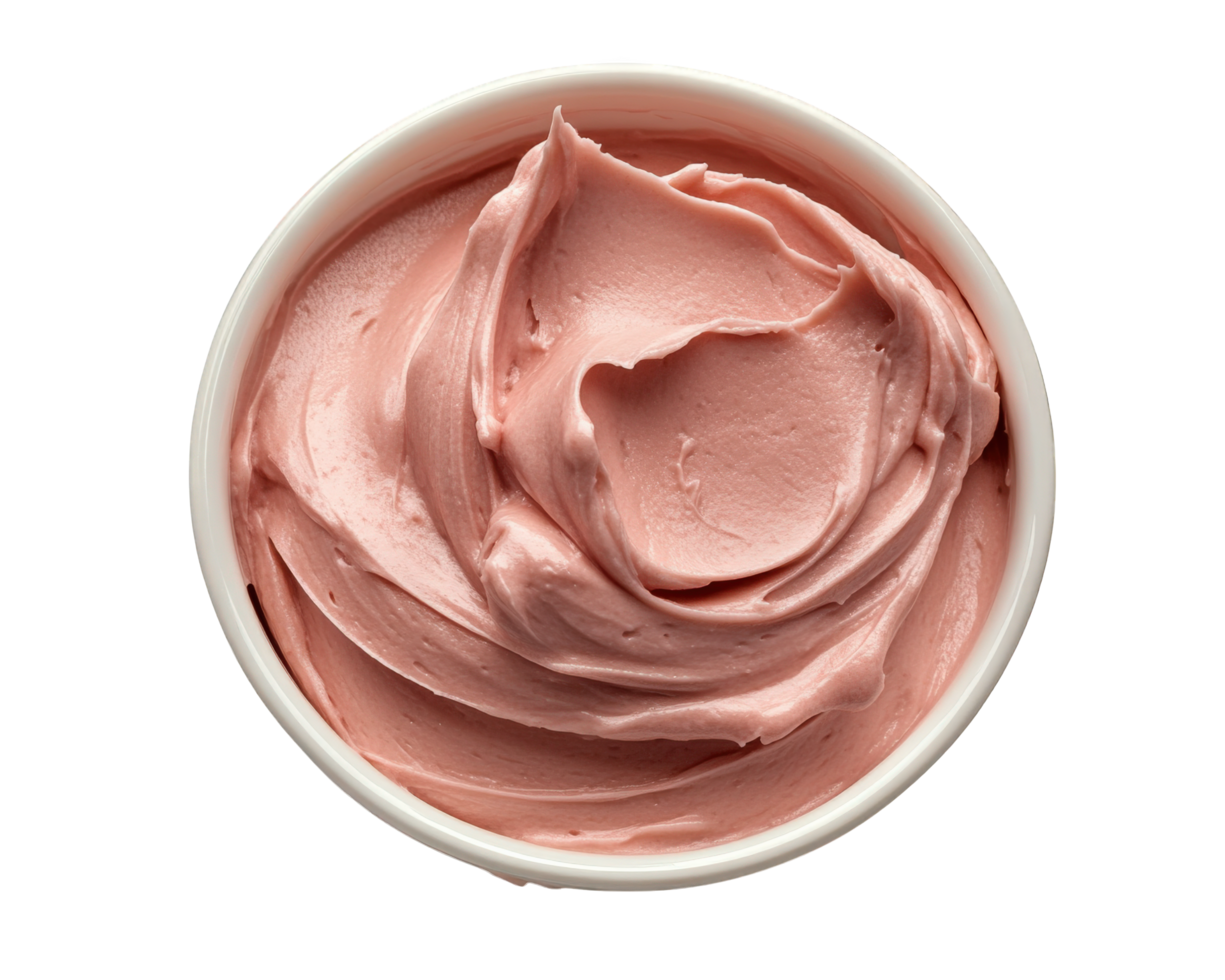 A bowl of pink frosting on a black background png