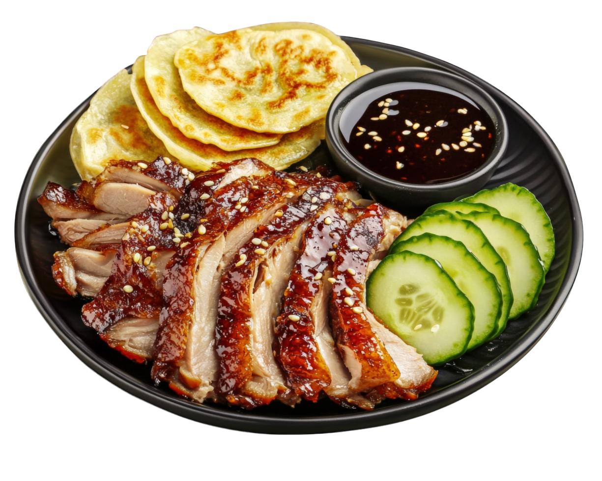 A plate with sliced pork, cucumber and sauce png