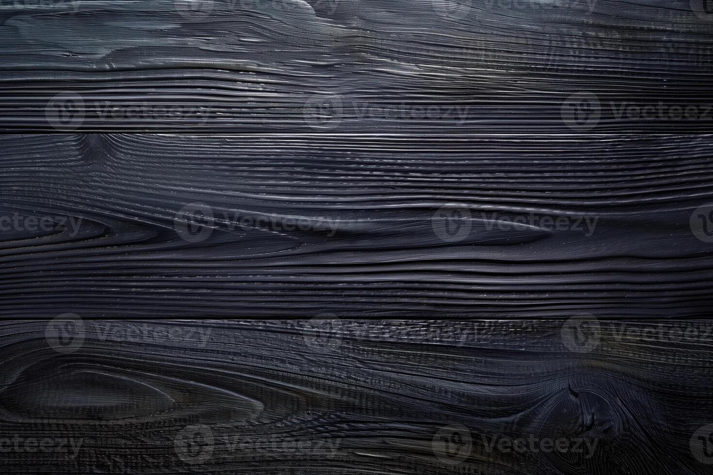 Dark, textured wooden planks with a smooth finish, showcasing natural grain patterns and a rich black color. photo