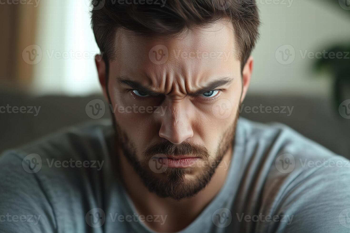 A man with a beard and a beard looking angry photo