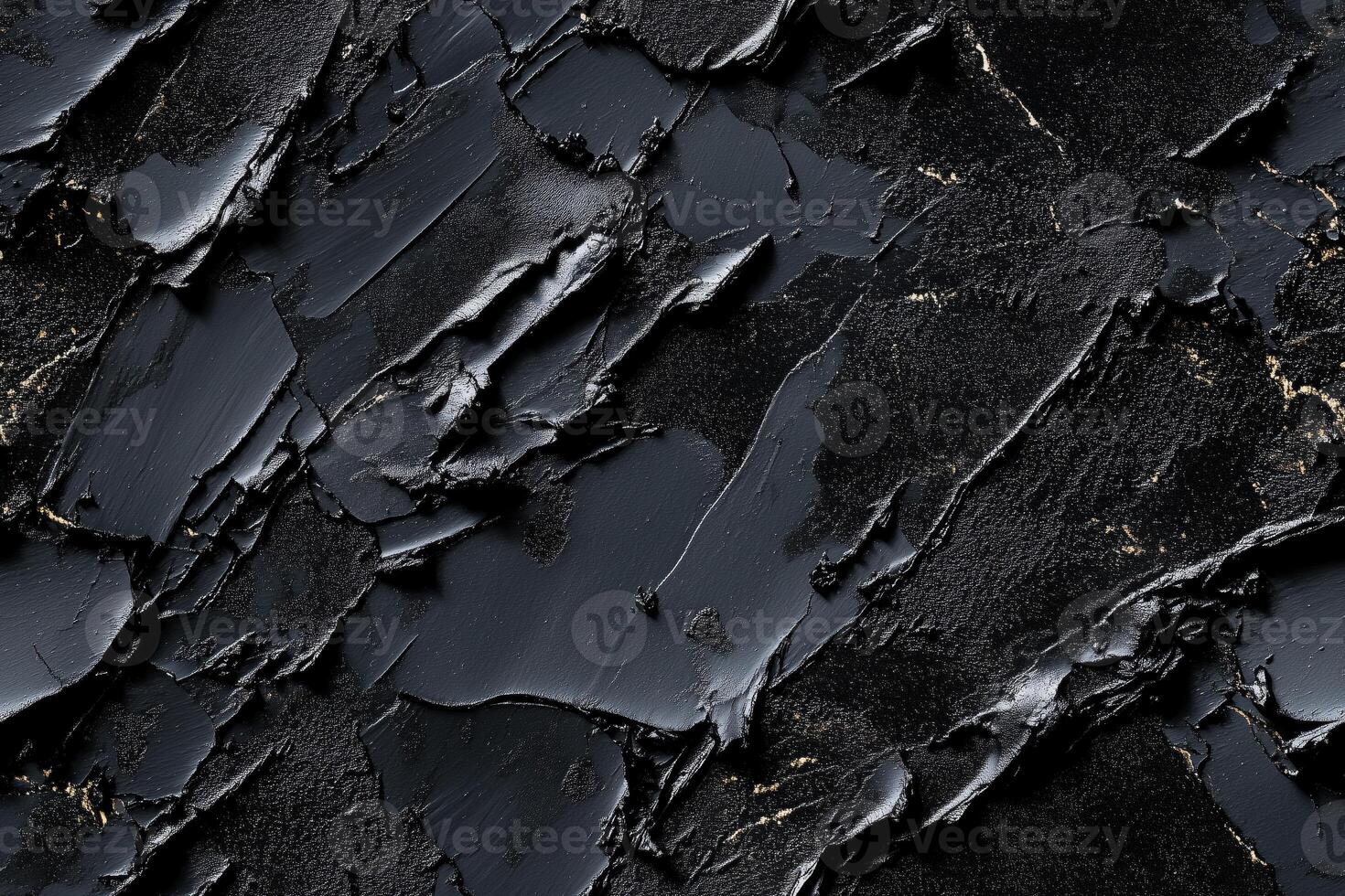 A black and gold paint texture with cracks photo