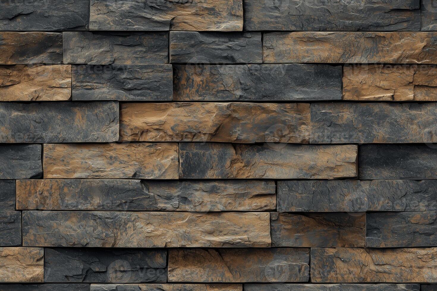 A textured wall made of stacked slate artesia stone cladding in varying shades of gray and brown. The stones are arranged in a horizontal pattern, showcasing natural variations in color and texture. photo
