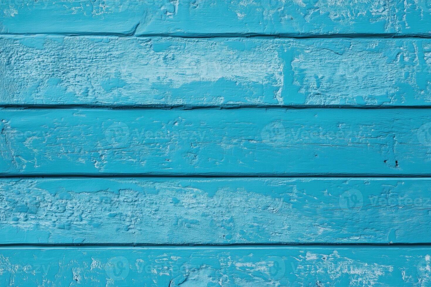 A close-up of a weathered blue wooden wall with visible texture and paint peeling. photo