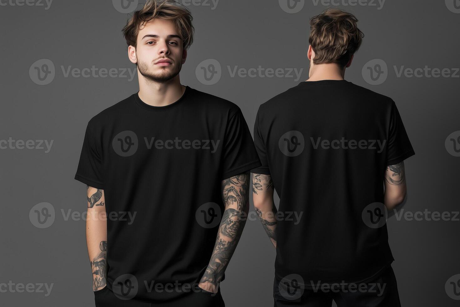 Two men in black t - shirts standing in front of a gray background photo
