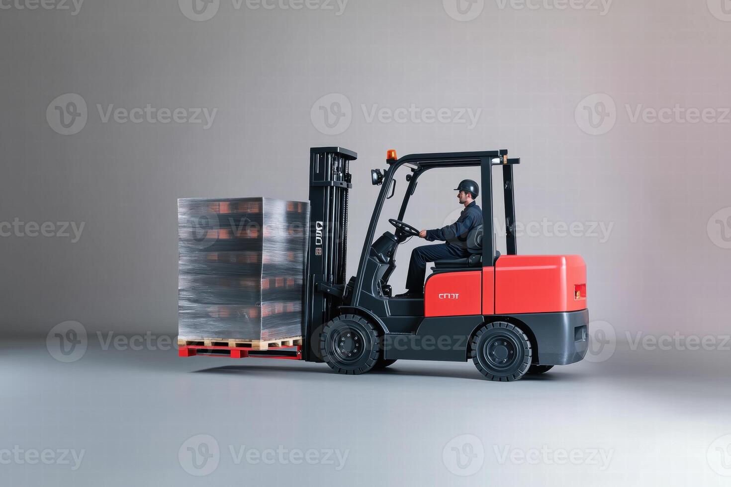 A forklift operator maneuvering a pallet stacked with goods. The forklift is red and black, set against a neutral background, highlighting the equipment and its load. photo
