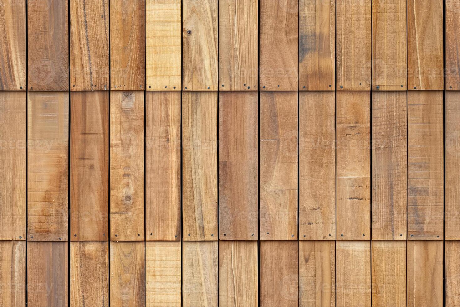 Wooden siding panel wall made of various planks, showcasing different shades and textures of wood. The planks are arranged in a horizontal pattern with visible nails and natural imperfections. photo