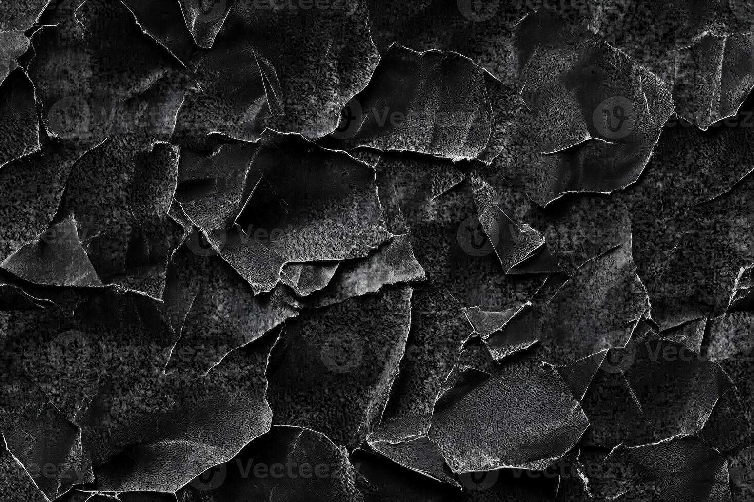 Seamless textured background featuring crumpled black paper with various shades and creases, creating a dramatic and artistic effect. photo