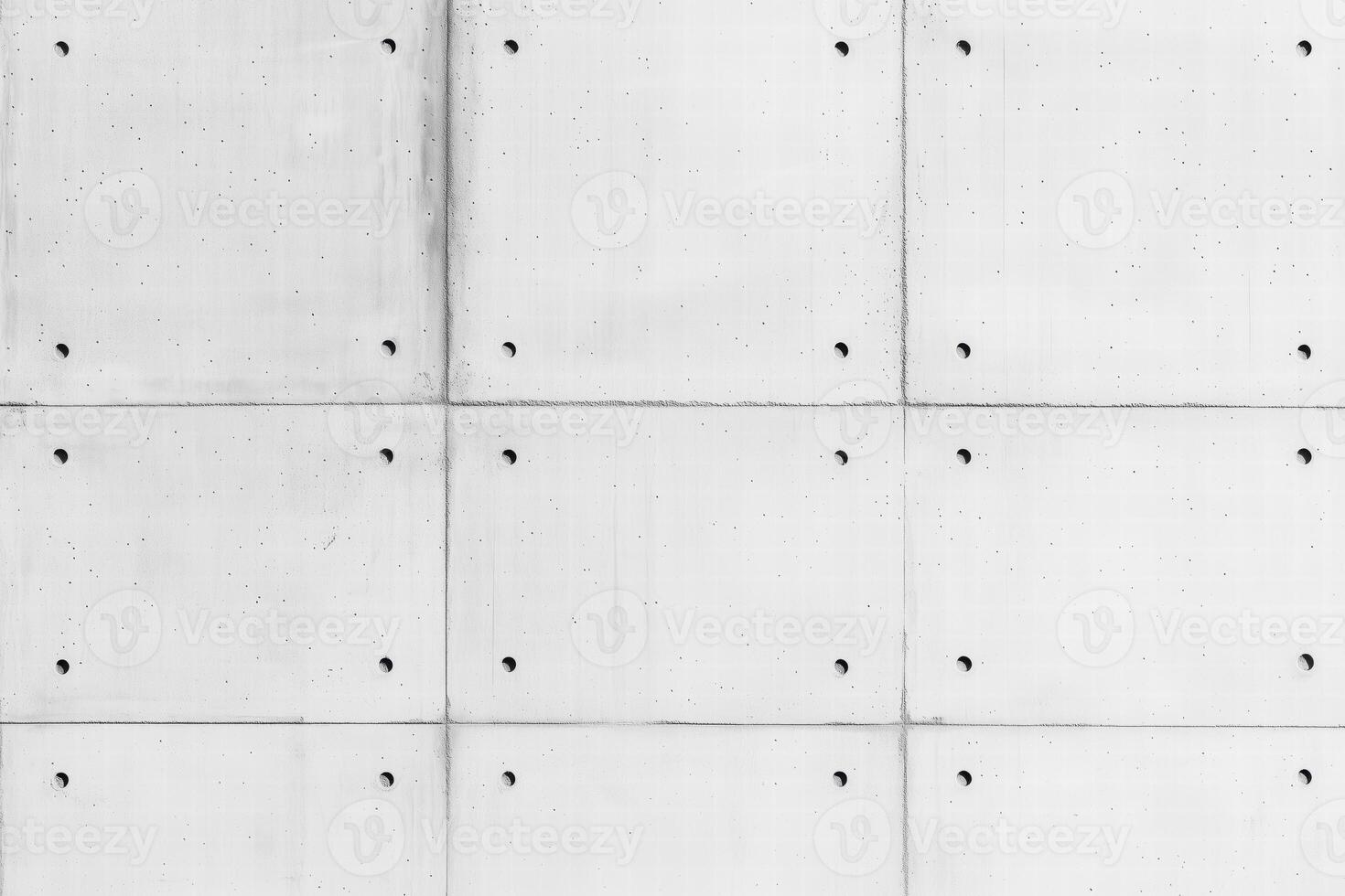 Seamless textured concrete wall with a grid pattern and small holes. photo