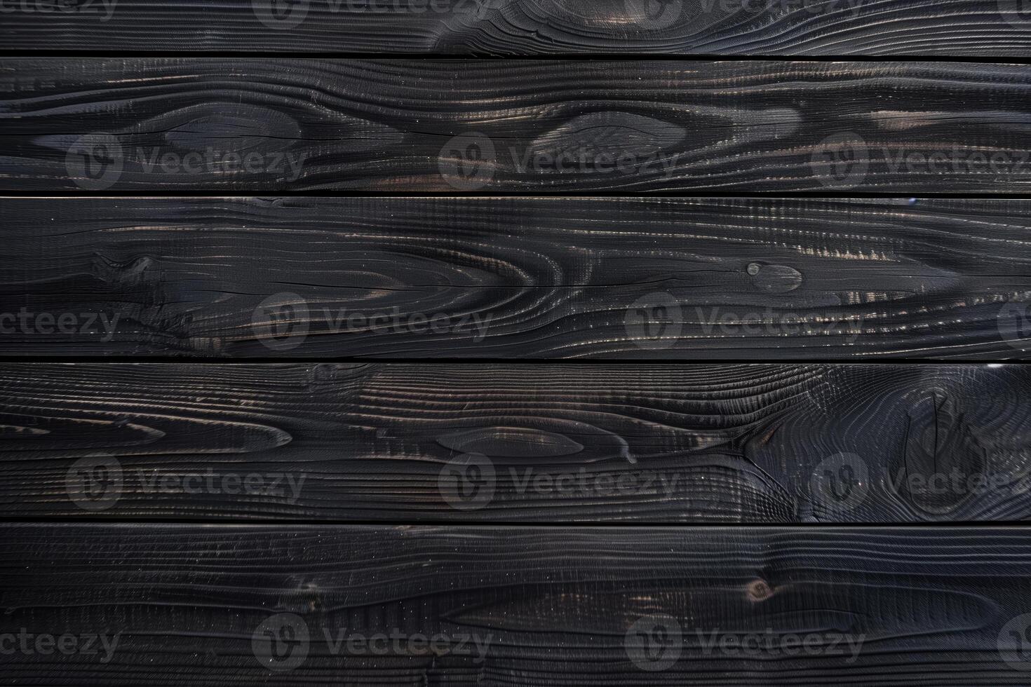 Dark, charred wooden planks with a smooth texture and visible grain patterns, creating a rustic and modern aesthetic. photo