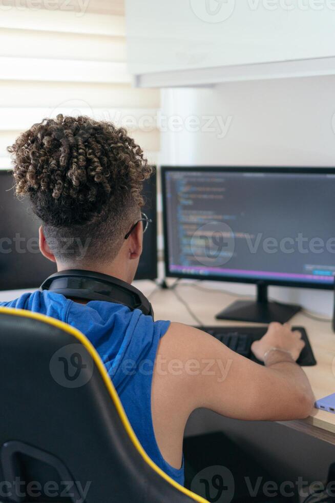 Computer programmer busy coding in his studio photo