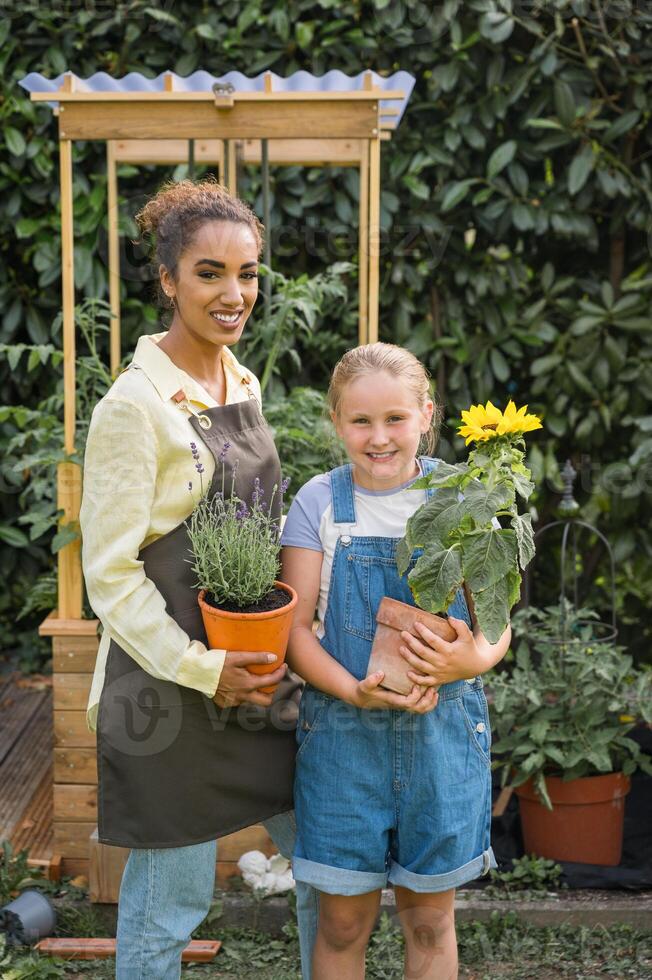 Happy mother with son in garden photo