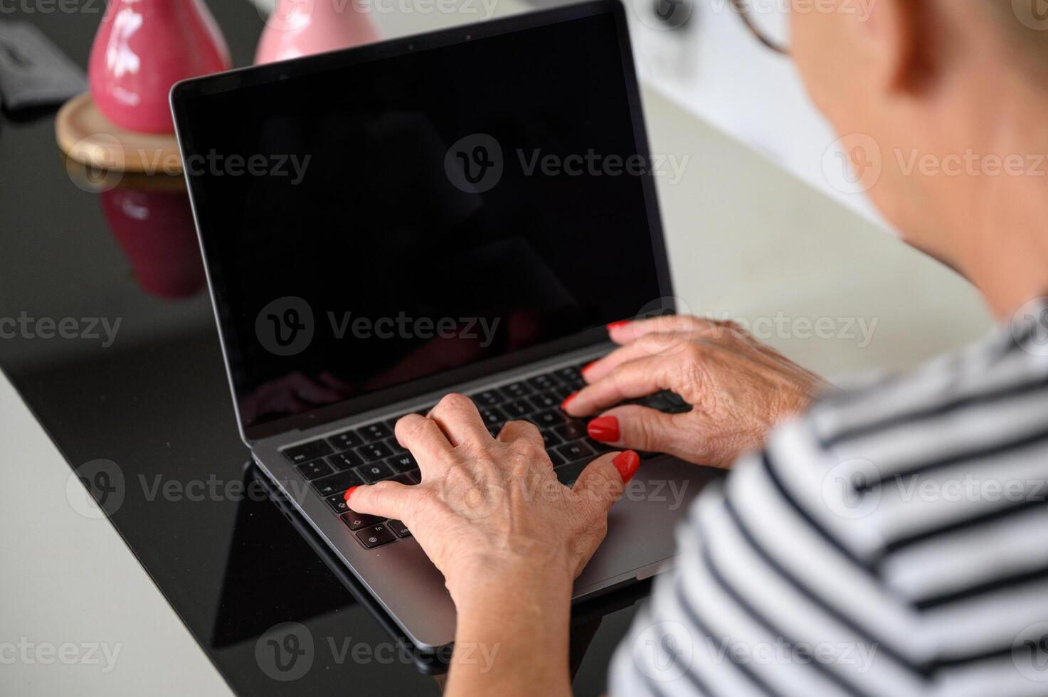 Crop man typing on laptop photo
