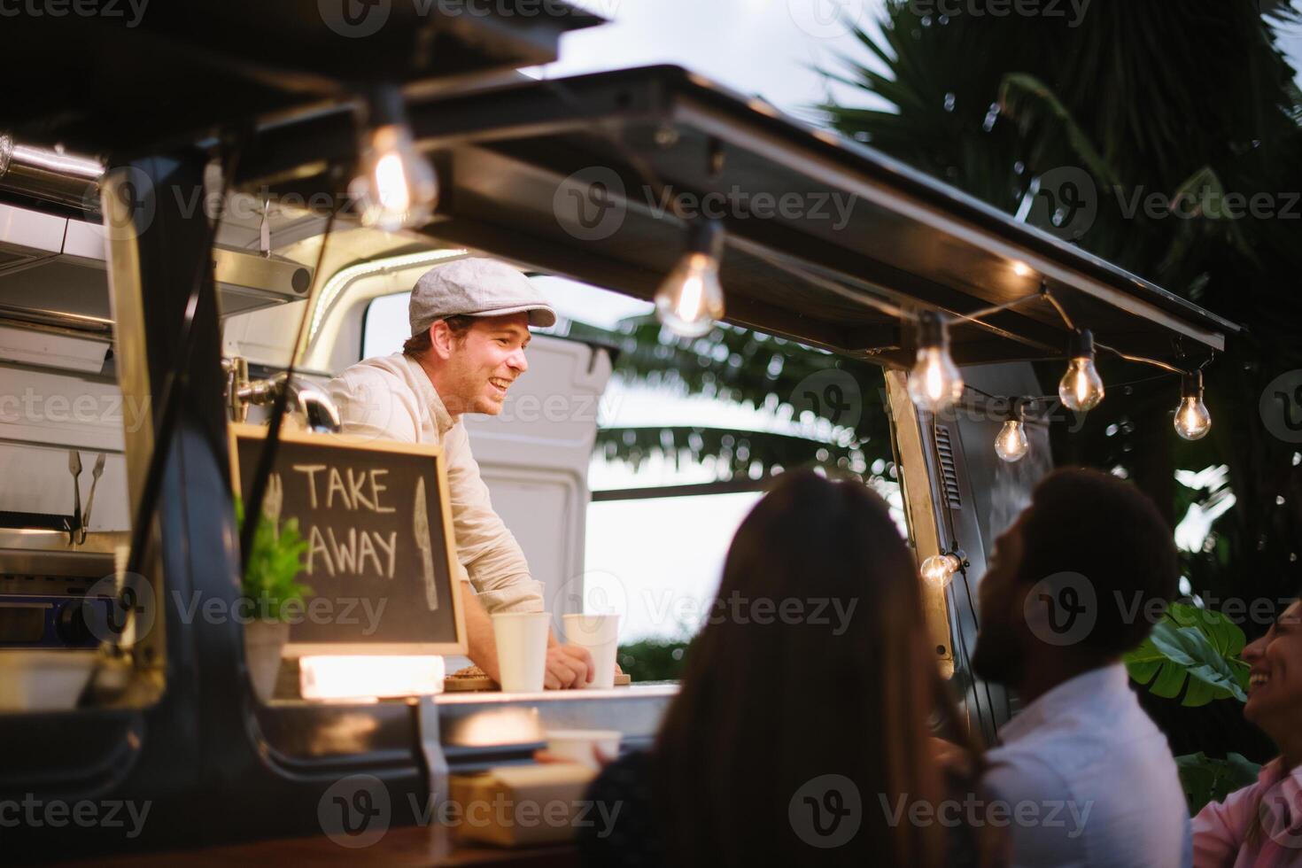 Happy vendor communicating with customers photo