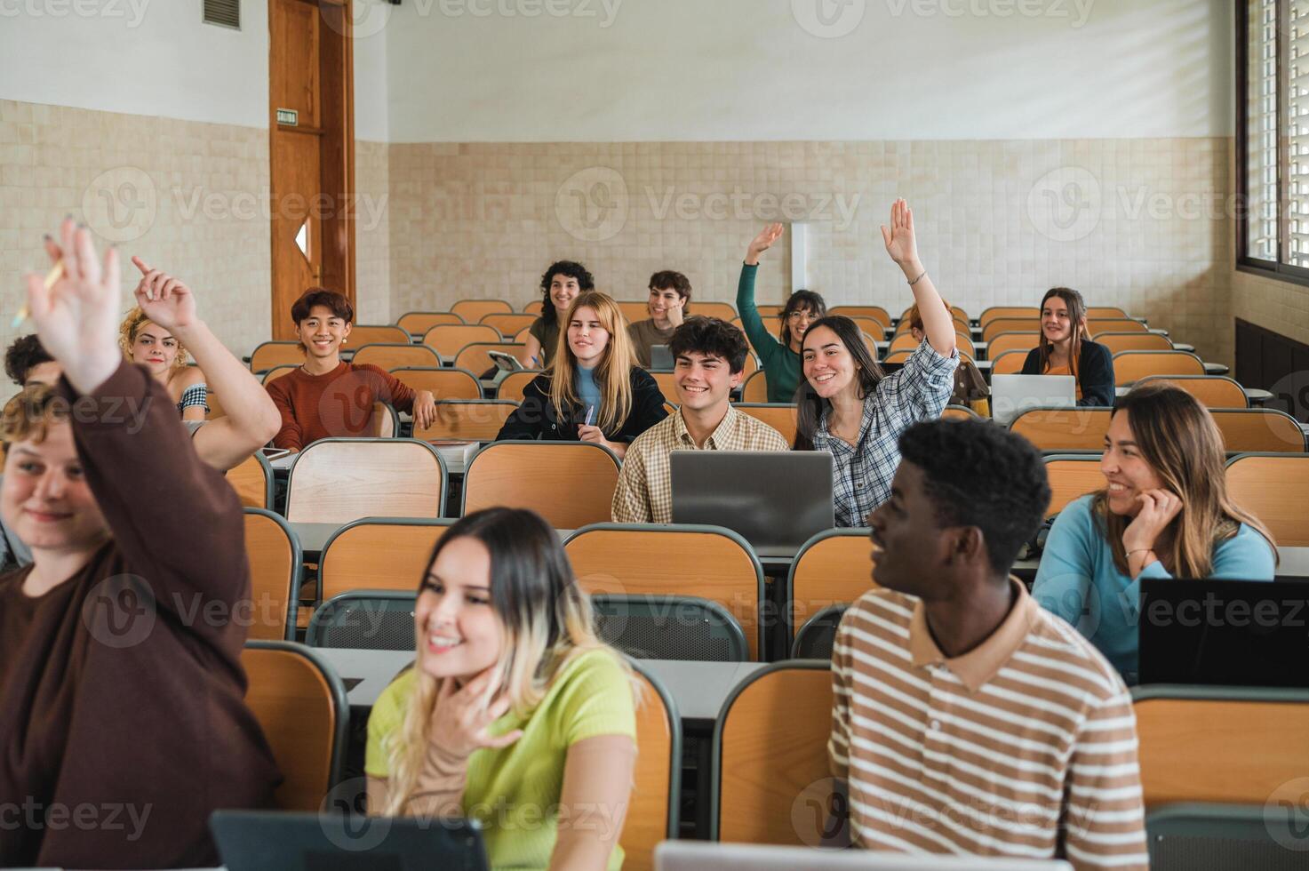 Students wishing to answer question photo
