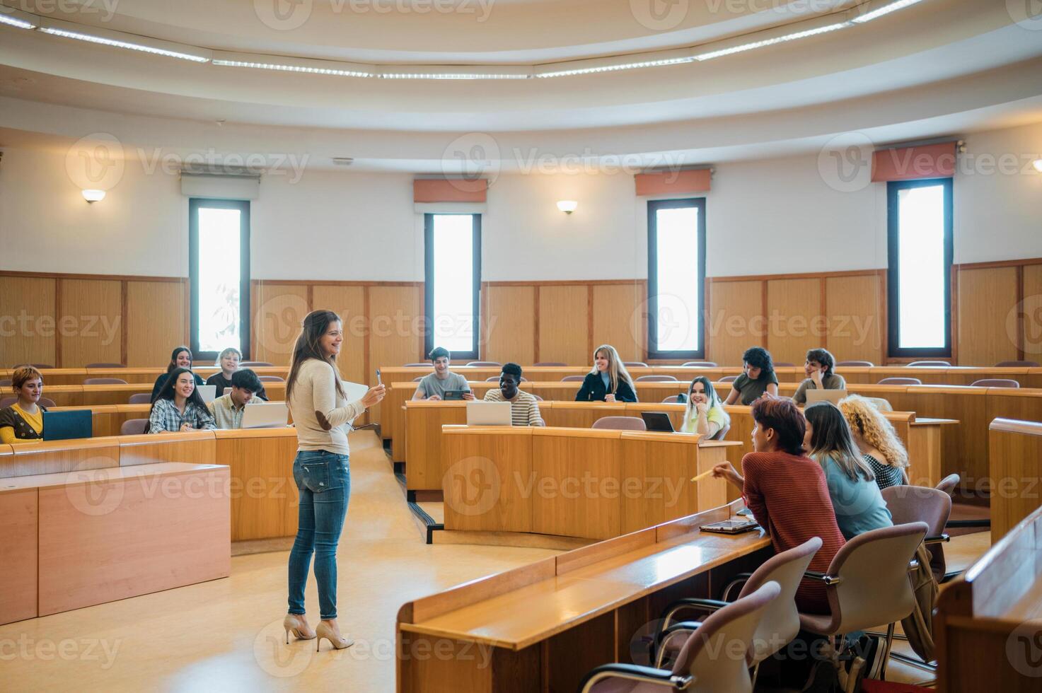 Cheerful teacher and students during lecture photo