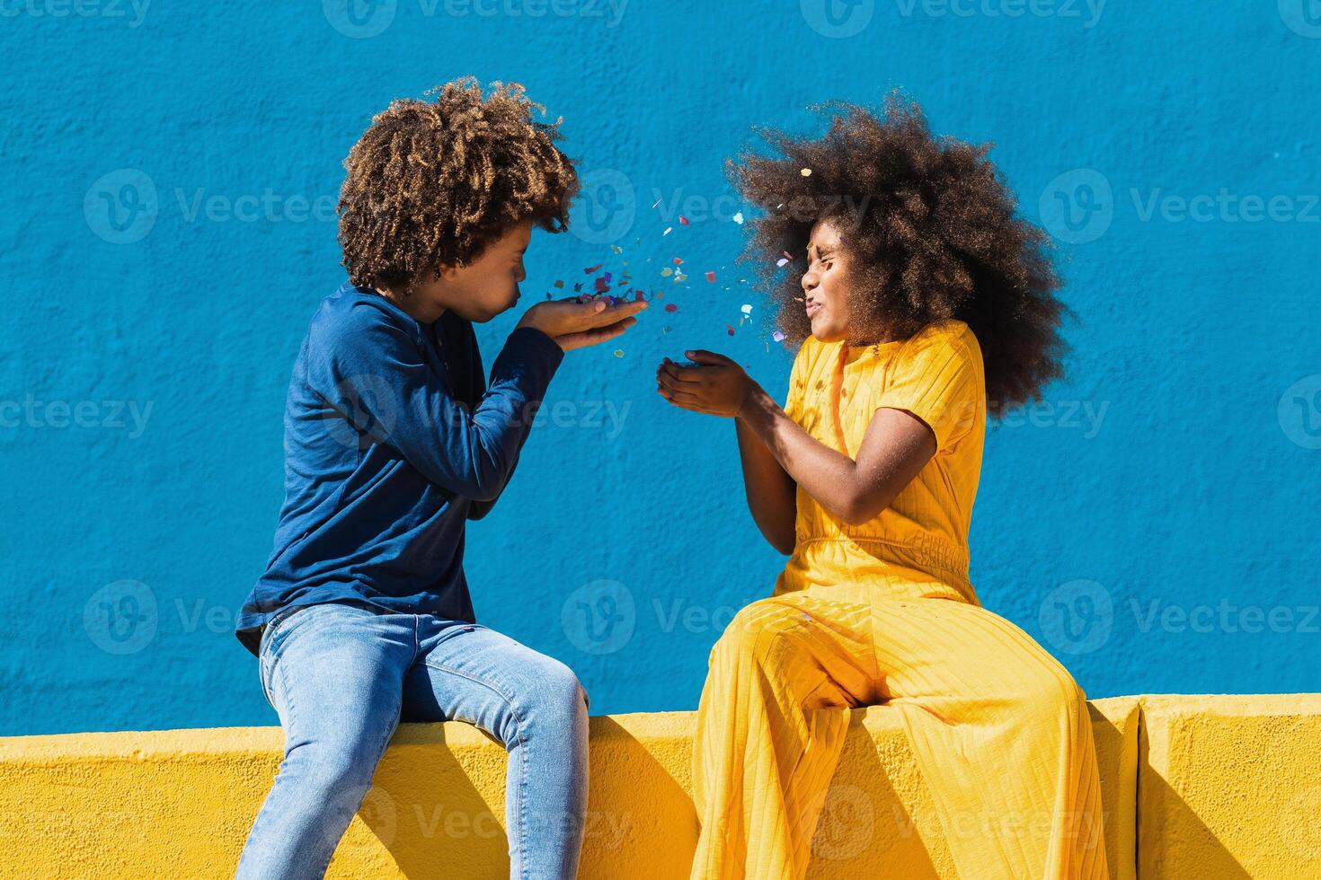 African American teenagers having fun with confetti photo