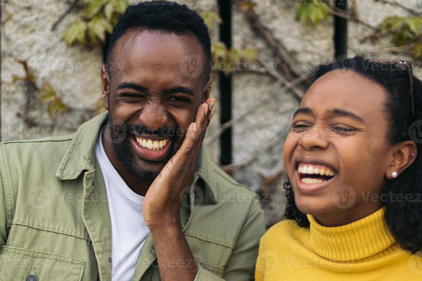 two black people portrait laughing. close-up photo
