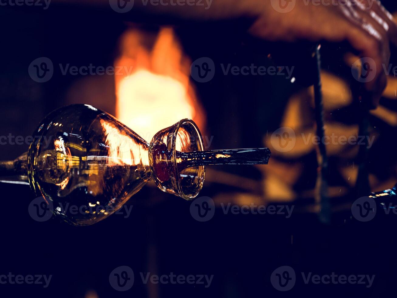 Transparent glass bottle near fire photo