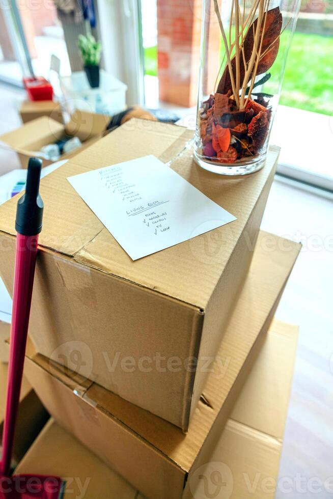 Stack of moving boxes with checklist photo
